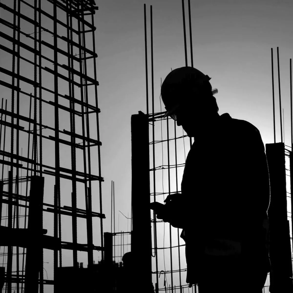 Site manager in front of reinforcement steel on a construction site